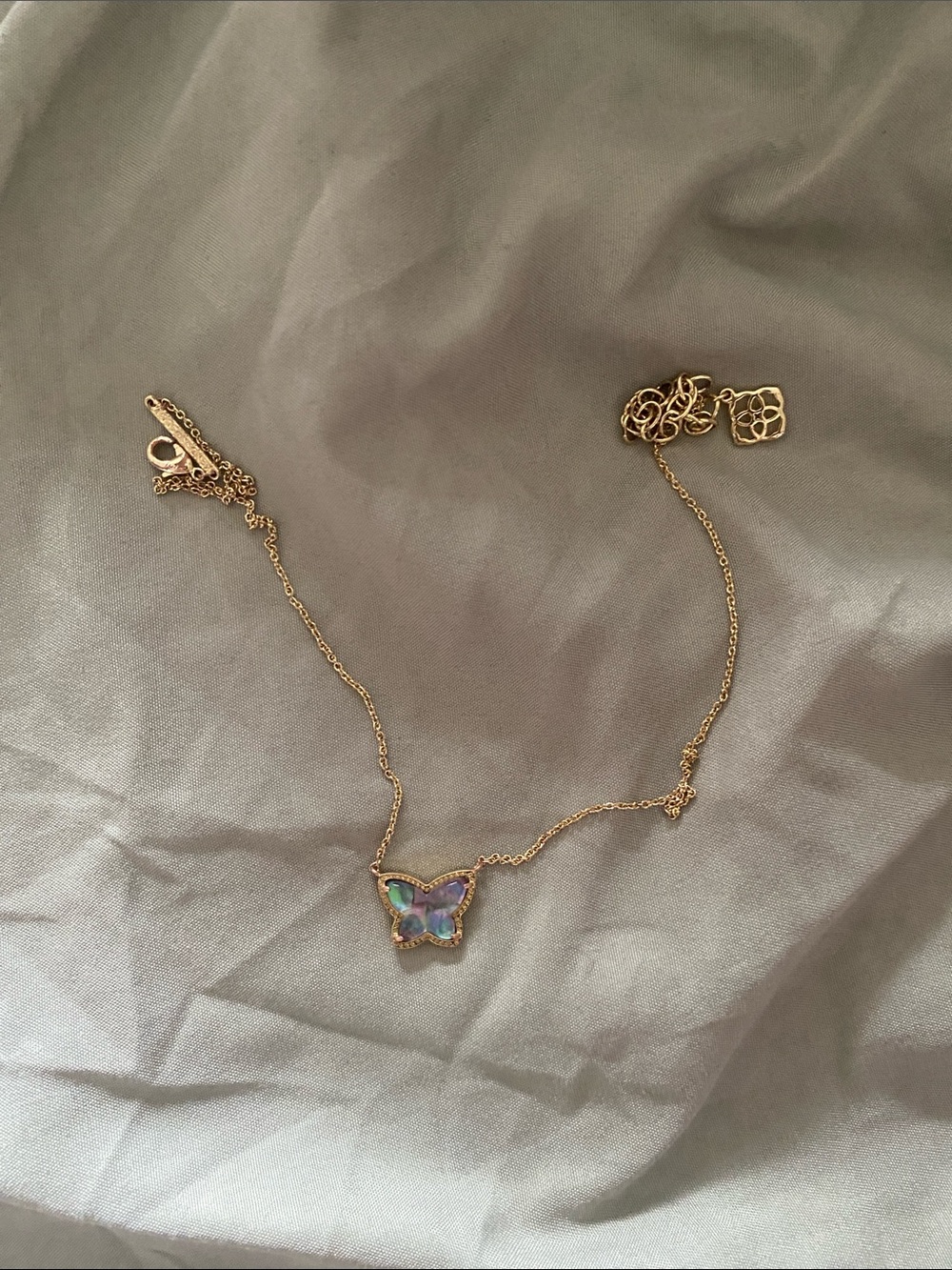 Kendra Scott Gold Butterfly Necklace with Blue-Green Iridescent Stones